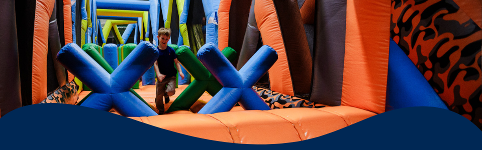A young person in an inflatable obstacle course.