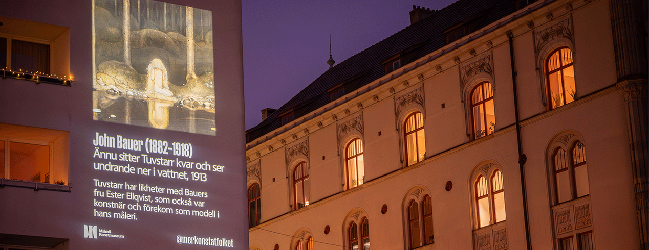 Konstverk projicerat på fasad på Gustav Adolfs torg